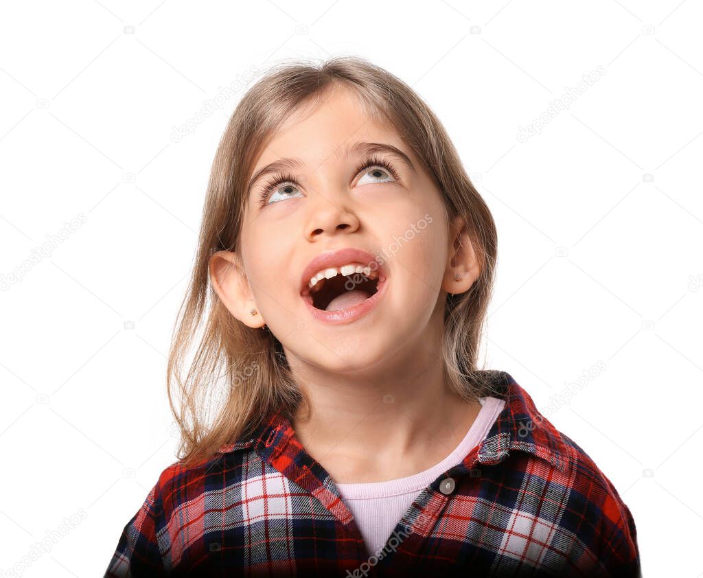 Happy little girl with healthy teeth on white background