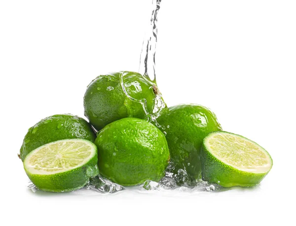 Water Pouring Fresh Limes White Background — Stock Photo, Image