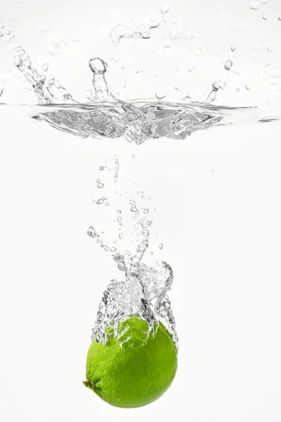 Falling Fresh Lime Water White Background Royalty Free Stock Photos