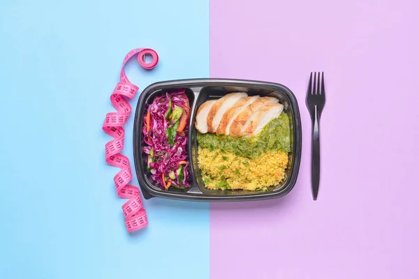 Container with healthy food and measuring tape on color background — Stock Image Container Healthy Food Measuring Tape Color Background Stock Picture