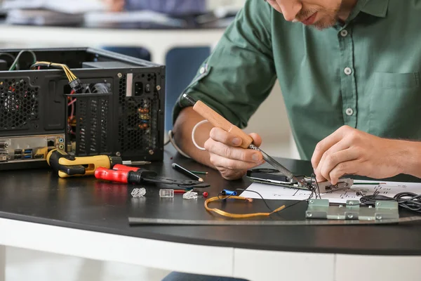 Electronic technician working in service center