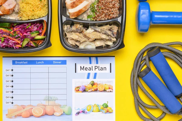 Containers with healthy food, sports equipment and meal plan on color background