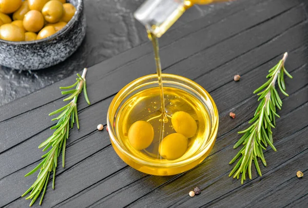 Pouring Tasty Olive Oil Bottle Bowl Table — Stock Photo, Image