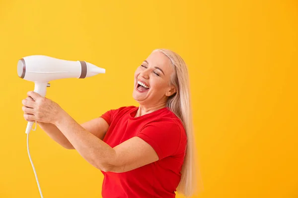 Beautiful Mature Woman Hair Dryer Color Background — Stock Photo, Image