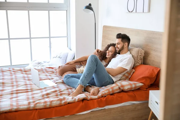 Happy Young Couple Watching Movie Bedroom — Stock Photo, Image