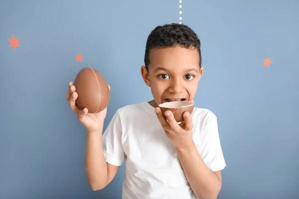 Cute African American Boy Sweet Chocolate Eggs Color Background — Stock Photo, Image