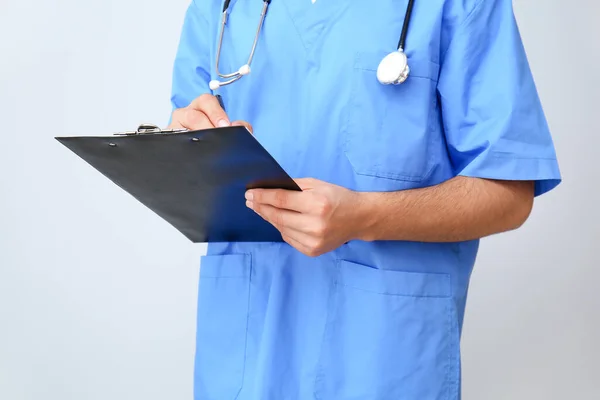 Handsome Male Doctor Documents Light Background Closeup — Stock Photo, Image