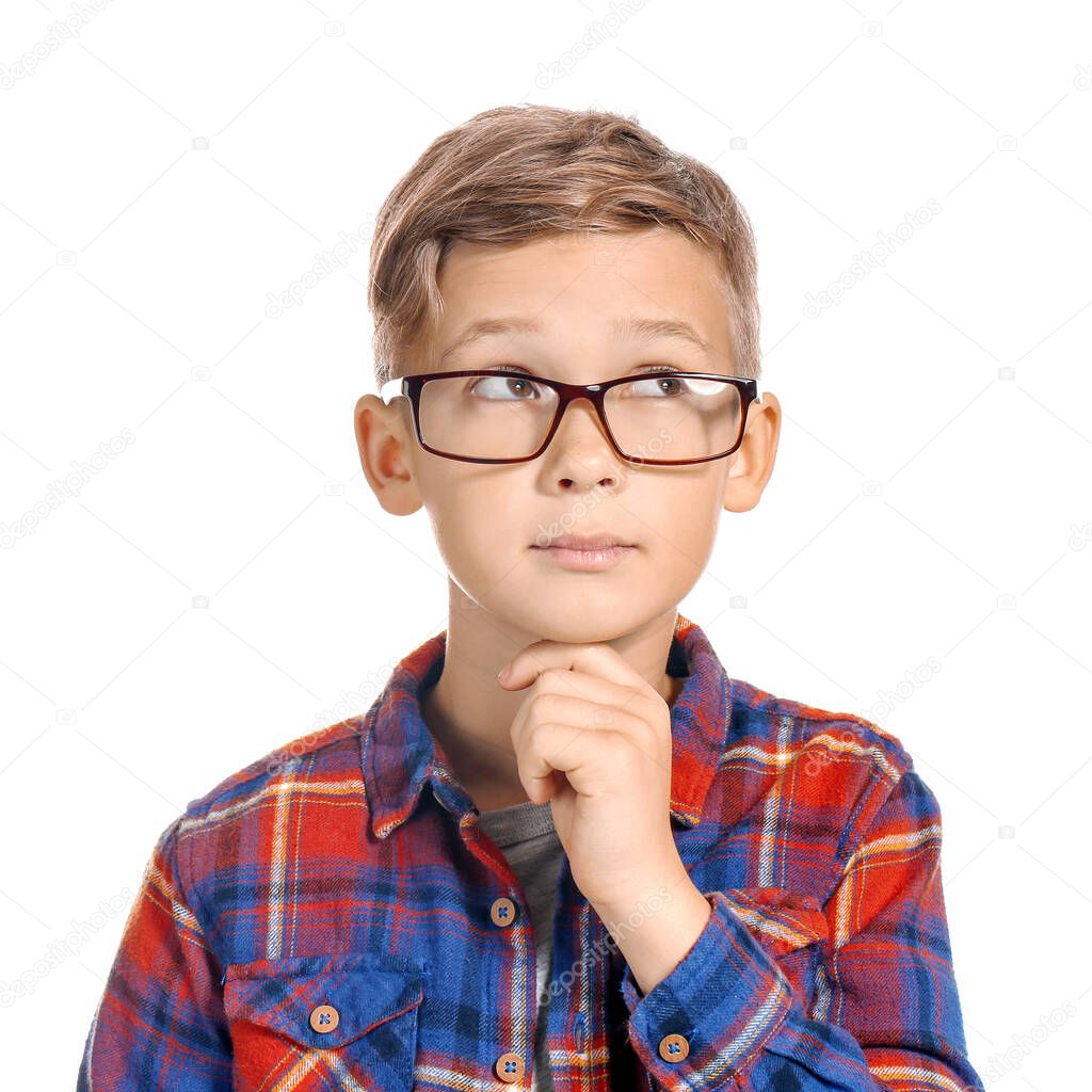 Cute little boy with eyeglasses on white background