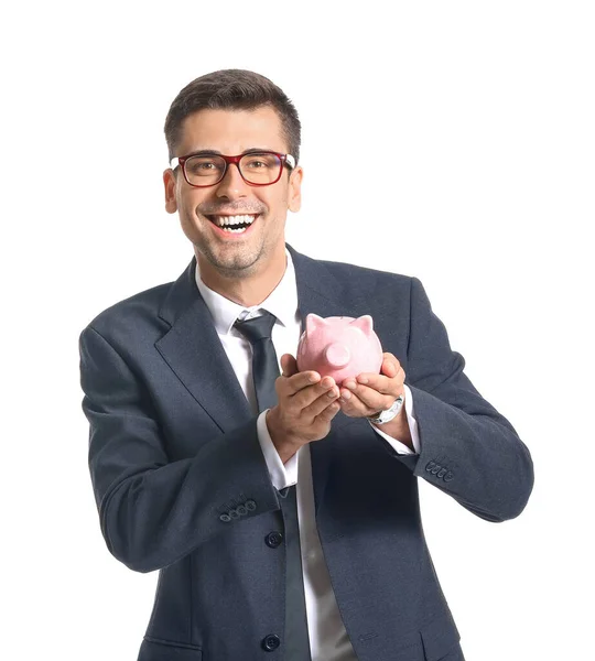 Happy male bank manager with piggy bank on white background