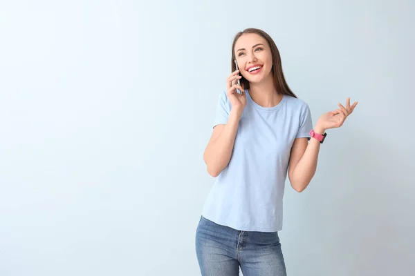 Young Woman Talking Mobile Phone Color Background — Stock Photo, Image