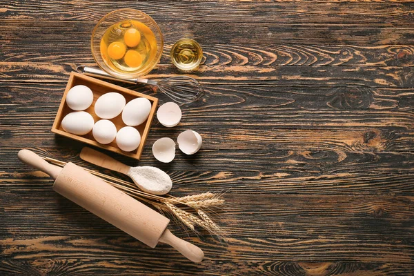 Ingredients for preparing bakery on wooden background