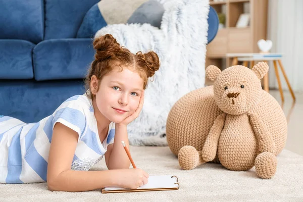 Cute Little Girl Writing Notebook Home — Stock Photo, Image