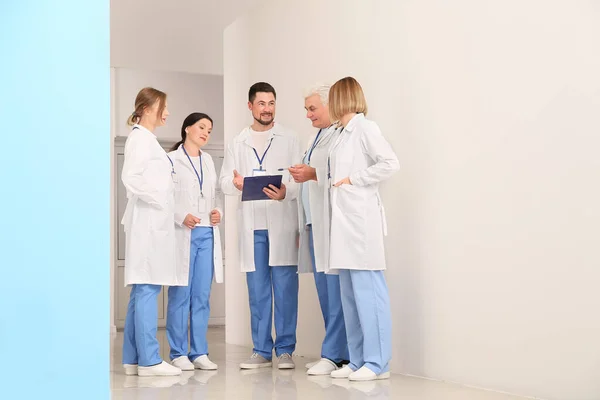 Doctors discussing something in hall of clinic