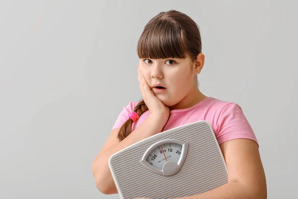 Shocked Girl Measuring Scales Light Background — Stock Photo, Image