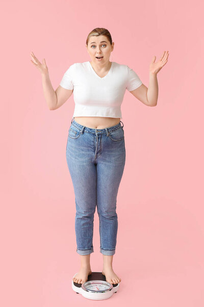 Overweight woman standing on scales against color background. Weight loss concept
