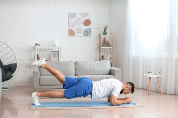 Sporty Young Man Training Home — Stock Photo, Image