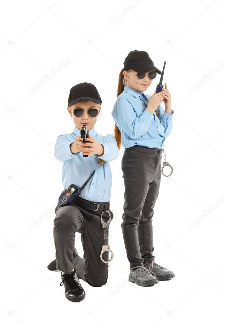 Cute little police officers on white background