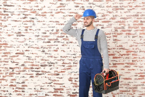 Handsome Male Worker Brick Background — Stock Photo, Image