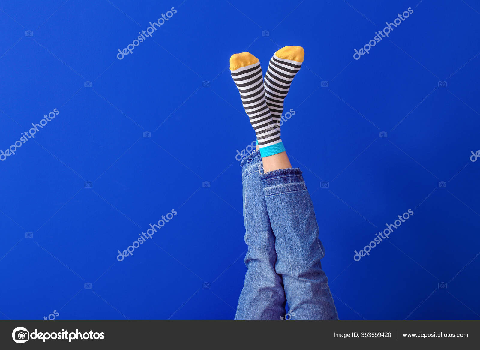 Legs Young Woman Striped Socks Color Background Stock Photo by