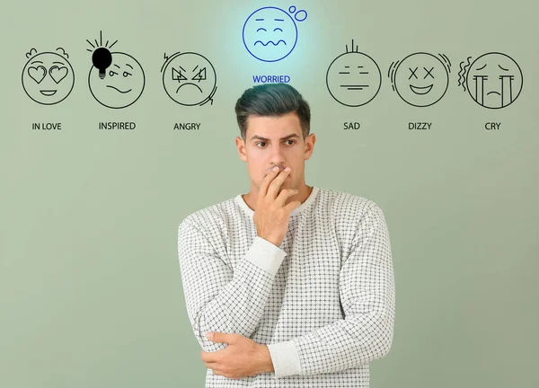 Worried Young Man Drawn Emoticons Color Background — Stock Photo, Image