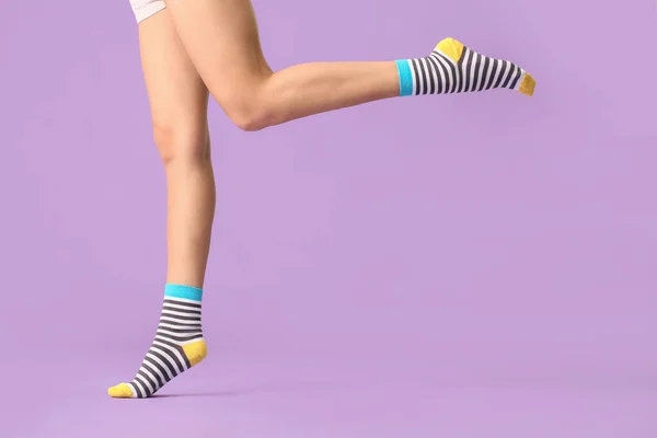 Legs Young Woman Striped Socks Color Background — Stock Photo, Image