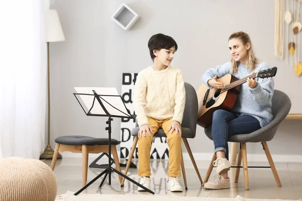 Private Music Teacher Giving Guitar Lessons Little Boy Home — Stock Photo, Image