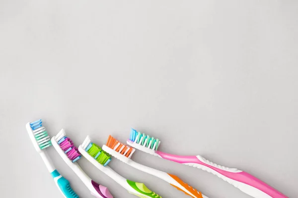 Many Tooth Brushes Light Background — Stock Photo, Image