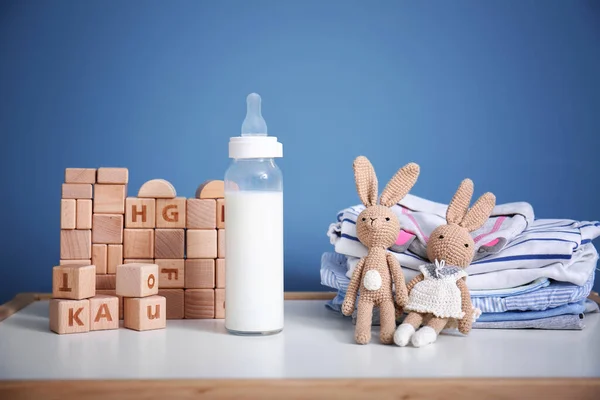 Toys Baby Bottle Milk Clothes Table Home — Stock Photo, Image