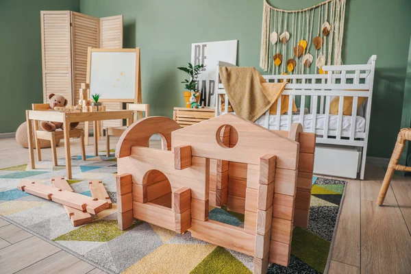 Take-apart playhouse in interior of children\'s room