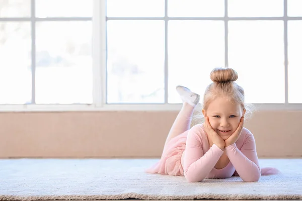 Cute little ballerina in dance studio