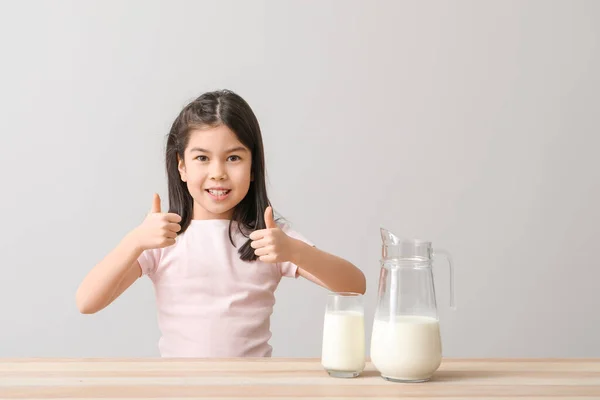 Cute Asian Girl Milk Showing Thumb Light Background — Stock Photo, Image