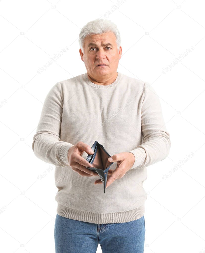 Sad senior man with empty purse on white background