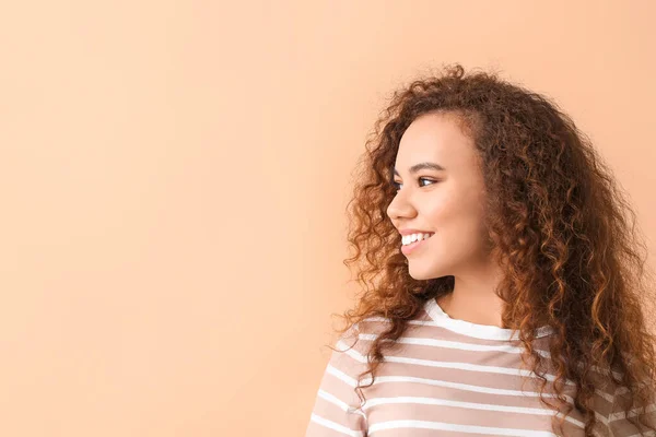 Happy woman with healthy teeth on color background