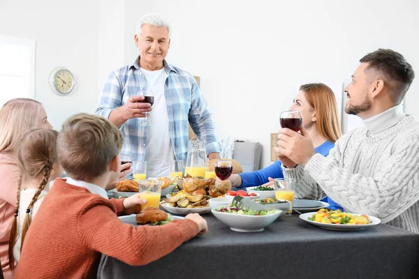 Family celebrating Thanksgiving Day at home