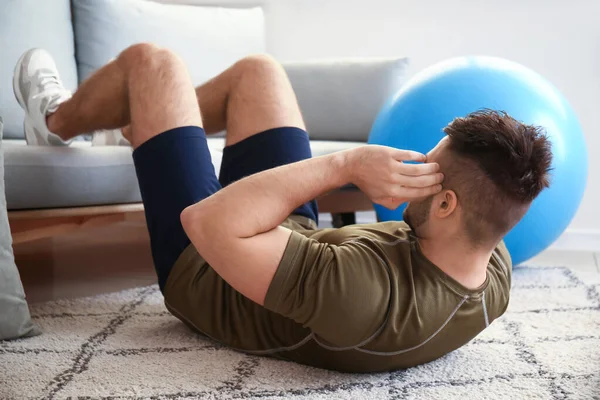 Sporty Young Man Training Home — Stock Photo, Image