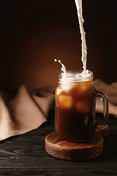 Pouring Milk Cold Coffee Mason Jar Table — Stock Photo, Image