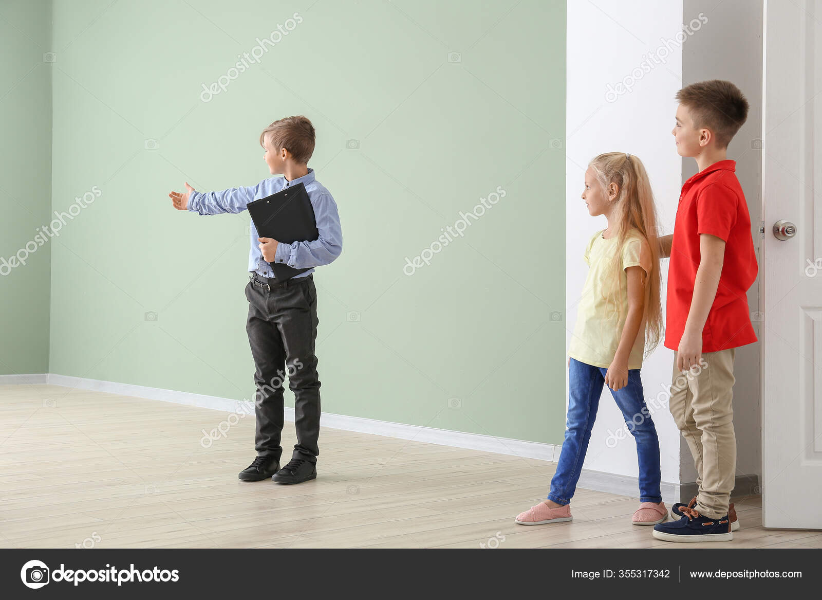Little Real Estate Agent Showing Clients New House Stock Photo by