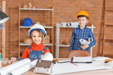 Cute little architects in office