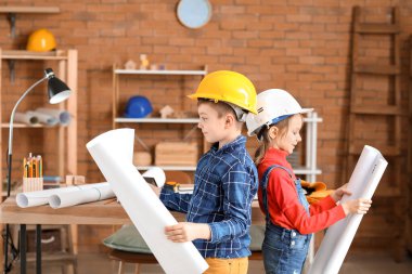 Cute little architects in office