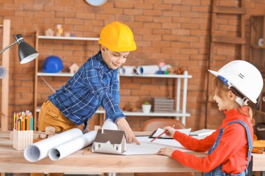 Cute little architects in office