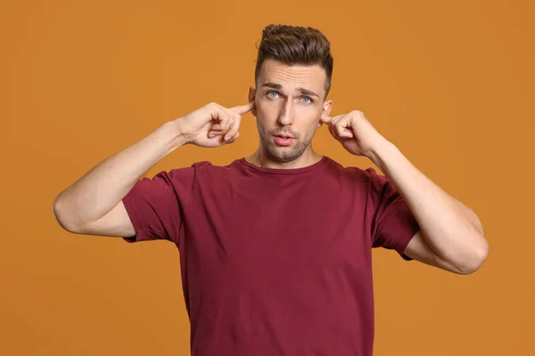 Young Man Closing Ears Hands Color Background — Stock Photo, Image