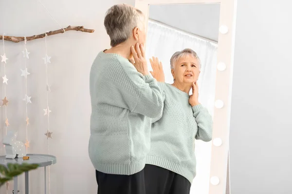 Displeased Senior Woman Looking Her Reflection Mirror — Stock Photo, Image