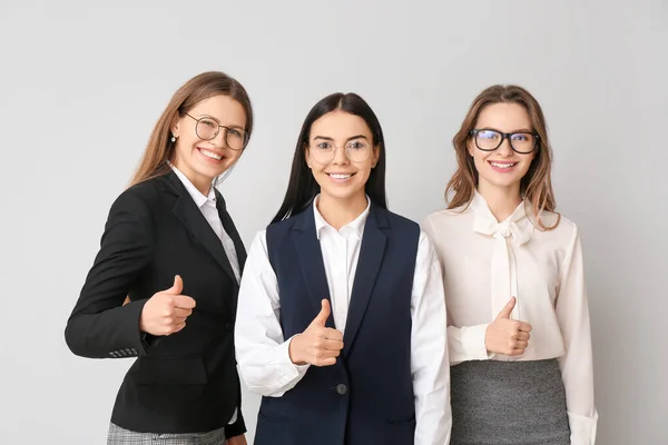 Beautiful Young Businesswomen Showing Thumb Gesture Light Background — Stock Photo, Image