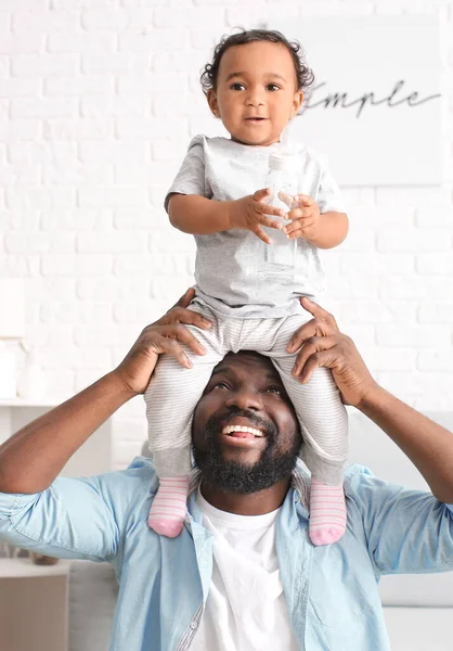 African American Man Playing His Cute Baby Home — Stock Photo, Image