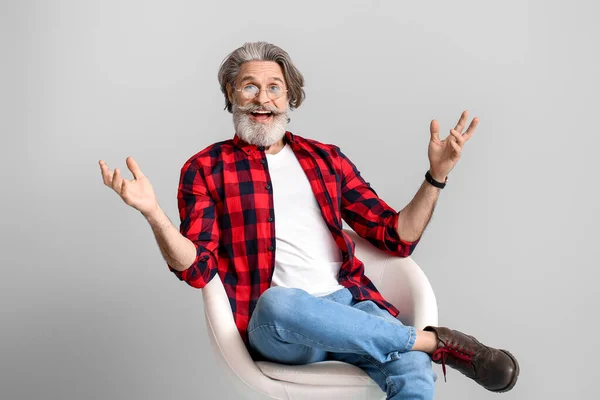 Happy Elderly Man Sitting Armchair Grey Background — Stock Photo, Image