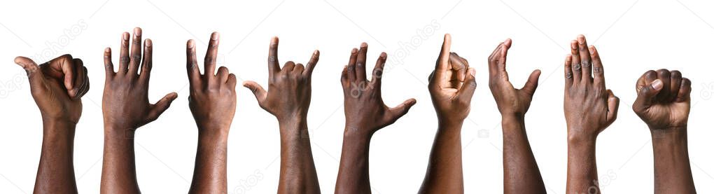 Gesturing hands of African-American men on white background