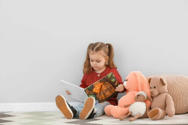 Cute Little Girl Reading Book Grey Wall — Stock Photo, Image