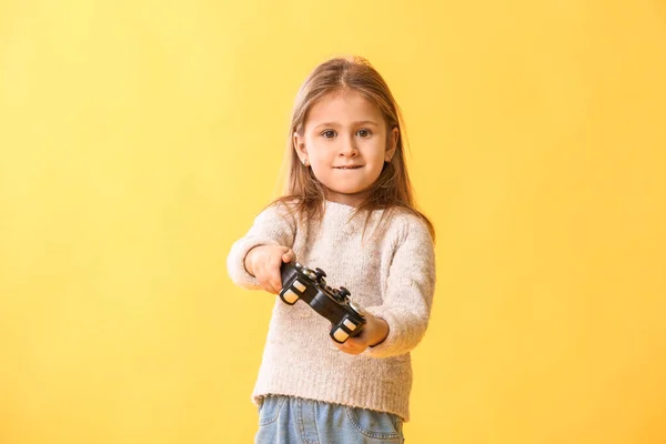 Cute Little Girl Playing Video Games Color Background — Stock Photo, Image