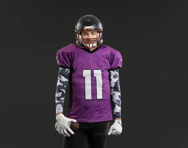 American football player on dark background