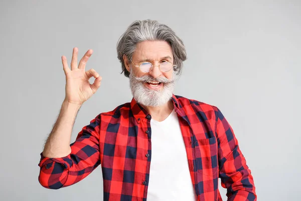 Stylish Elderly Man Showing Gesture Grey Background — Stock Photo, Image